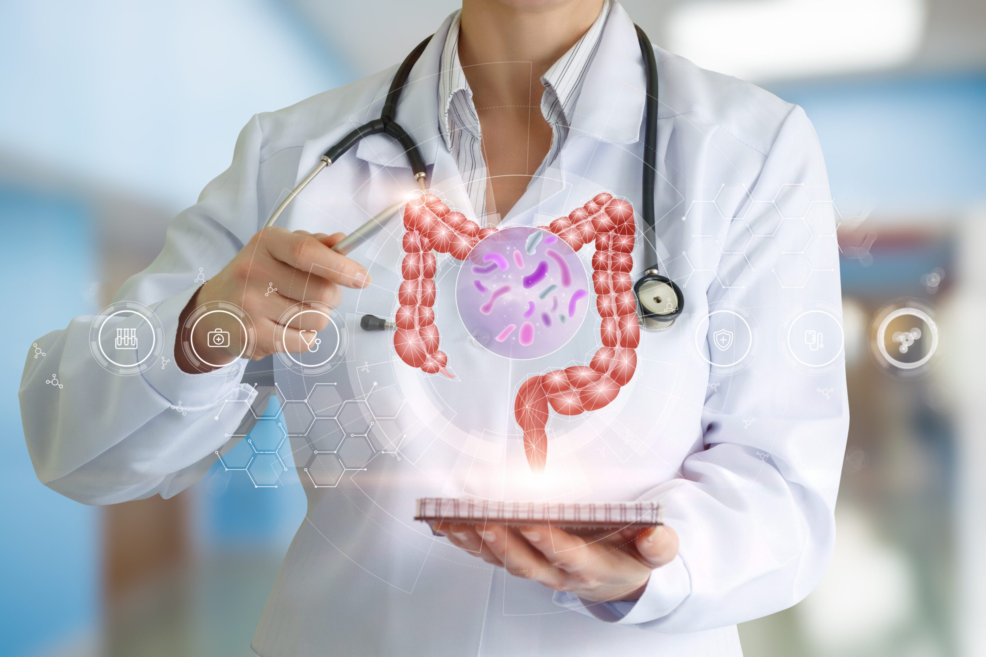 Doctor analyzing digital intestine hologram on tablet.